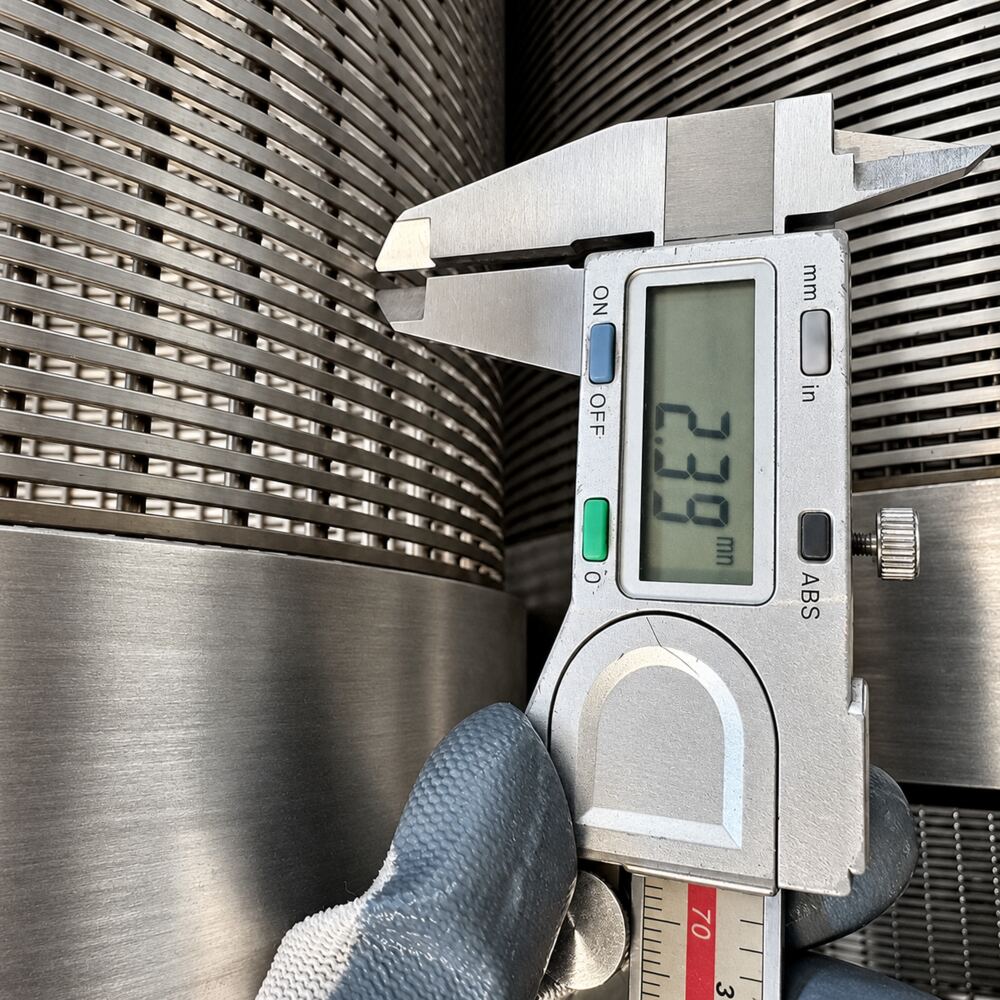 Digital caliper inspecting a wedge wire screen slot