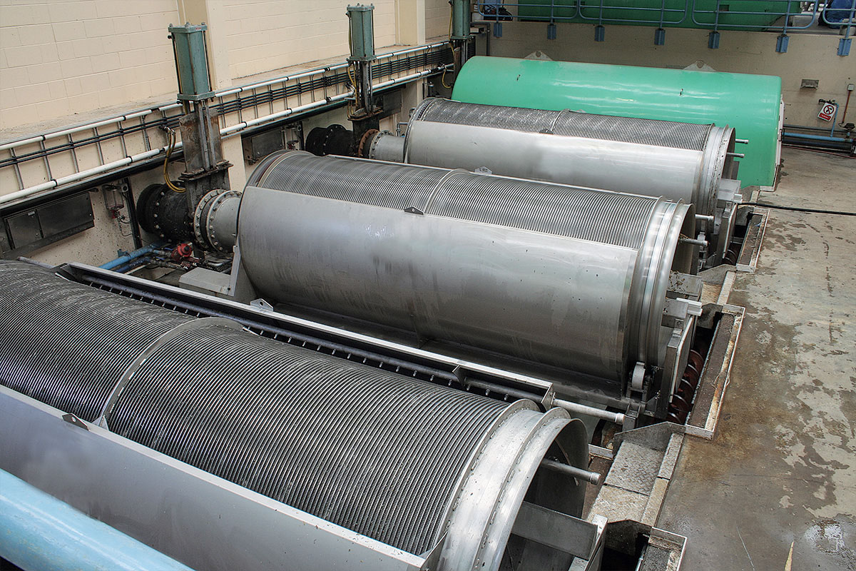 Typical industrial drum screening equipment in a processing plant